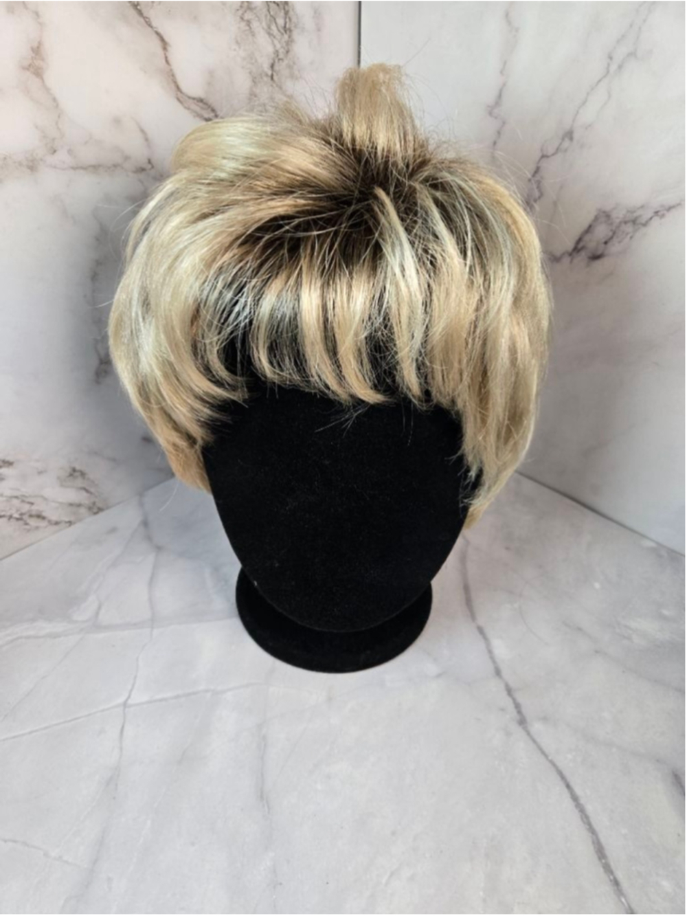 Classique Collection - Cheri - Pixie Cut Style Wig in the Shade Rooted Blonde.